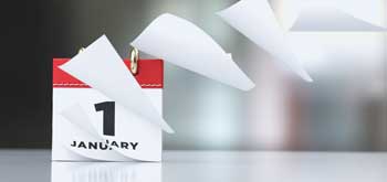 A desktop calendar with the date of January 1st on it