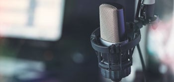 A close up image of a microphone used for a podcast