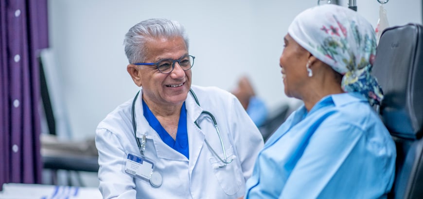 A doctor speaking to a cancer patient