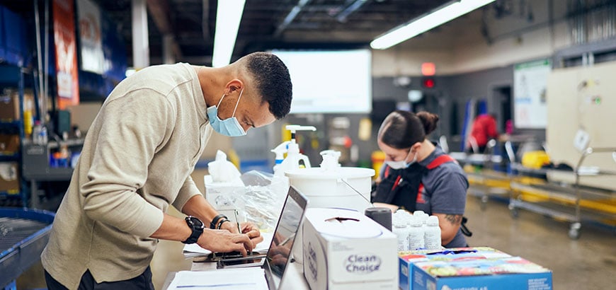 Two people working in a distribution center