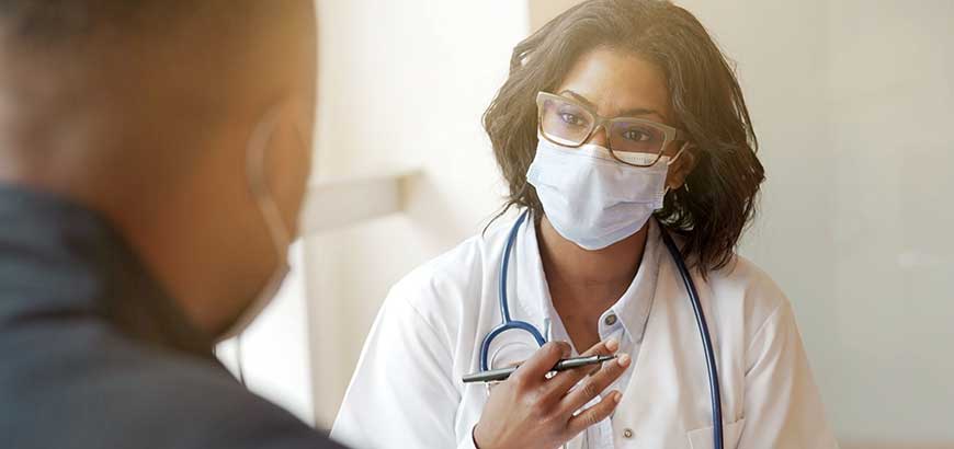 A doctor speaking with a patient