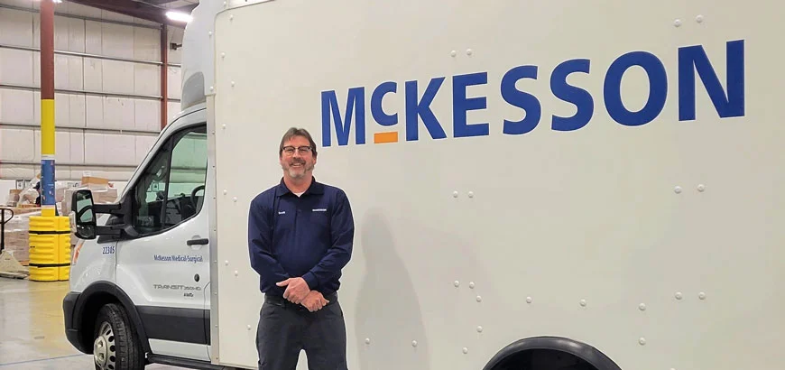 Scott Neidig standing beside his McKesson truck