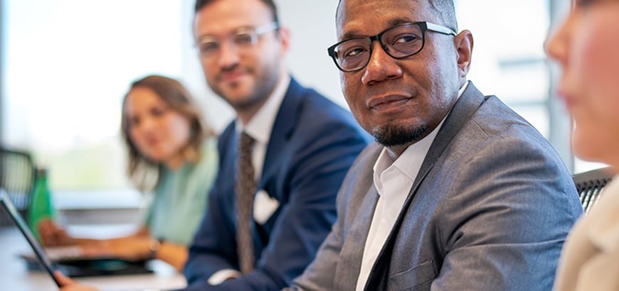 Men sit at a conference table