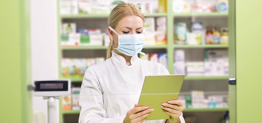 A pharmacist using a tablet