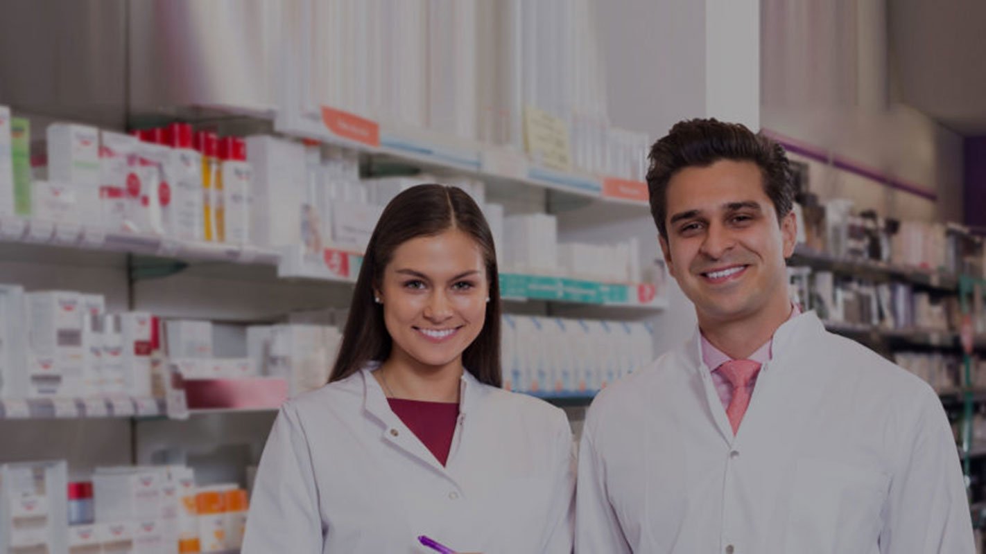 Two pharmacists behind the counter